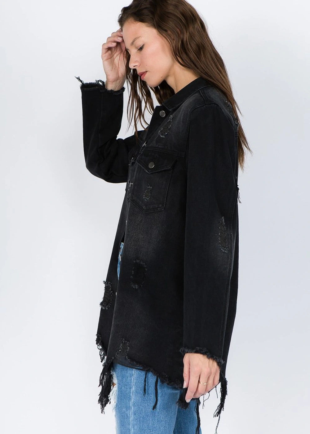 Distressed denim jacket with frayed hem